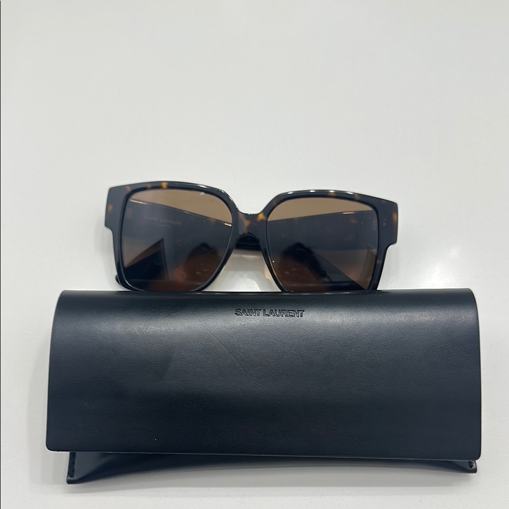 Yves Saint Laurent tortoise oversized glasses.